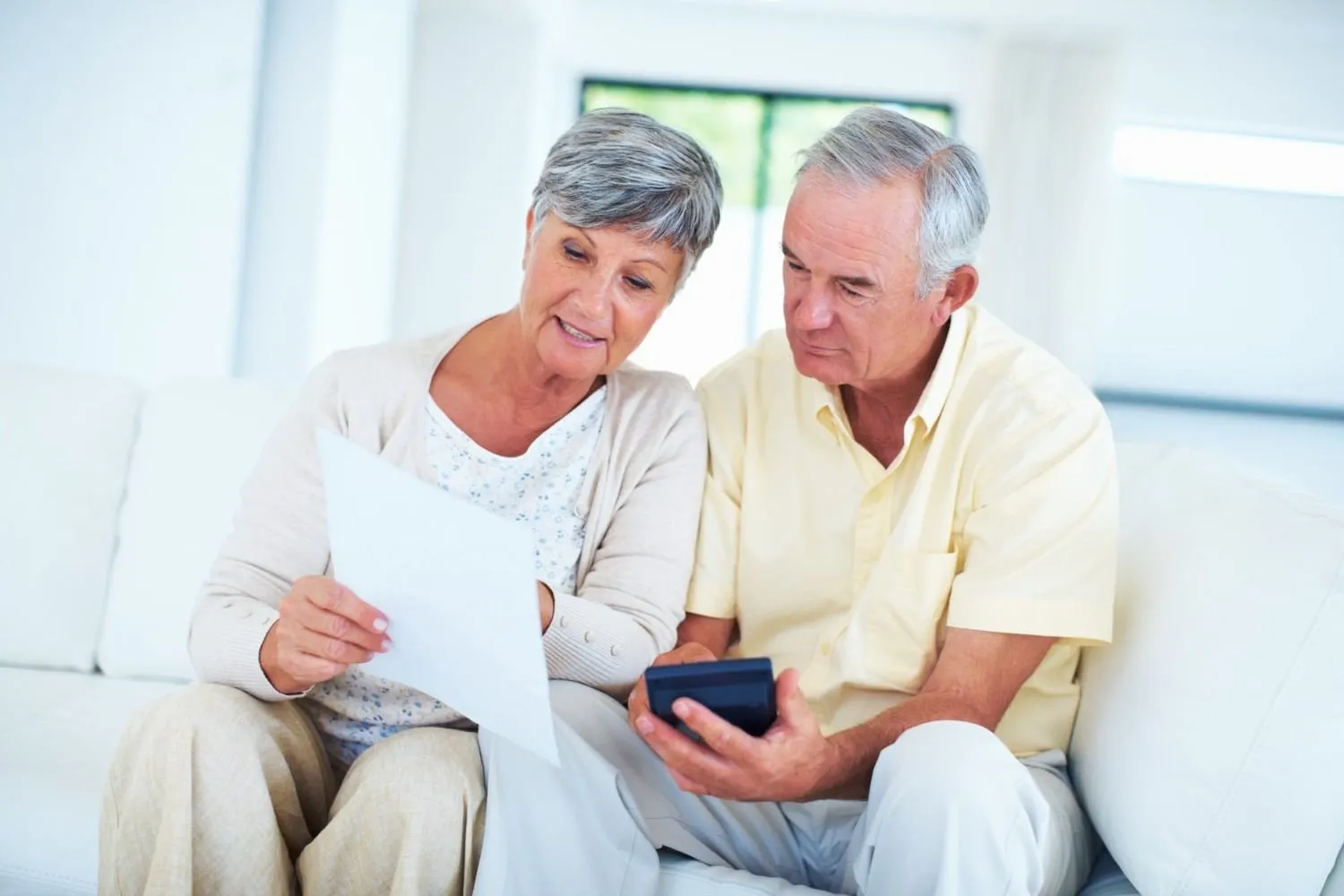 An older couple going through their coverage paperwork together